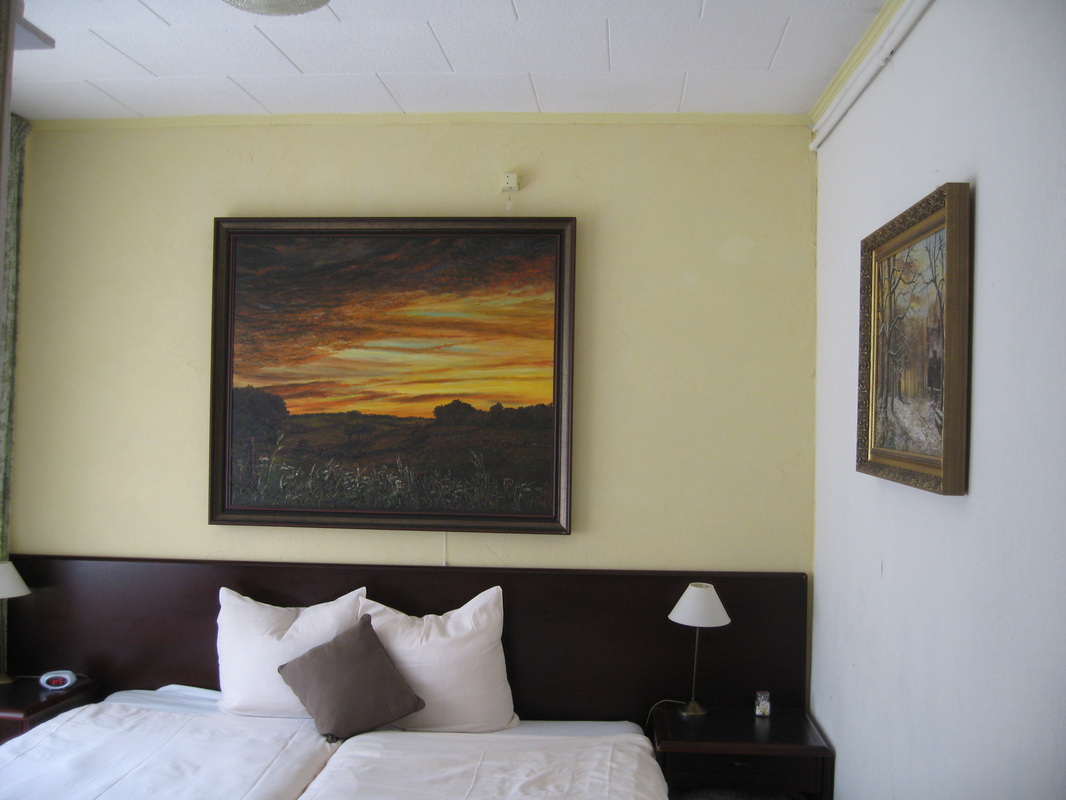 slaapkamer met avondschilderij alfonssmeets